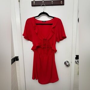 Red mini dress with ruffle details and tie front